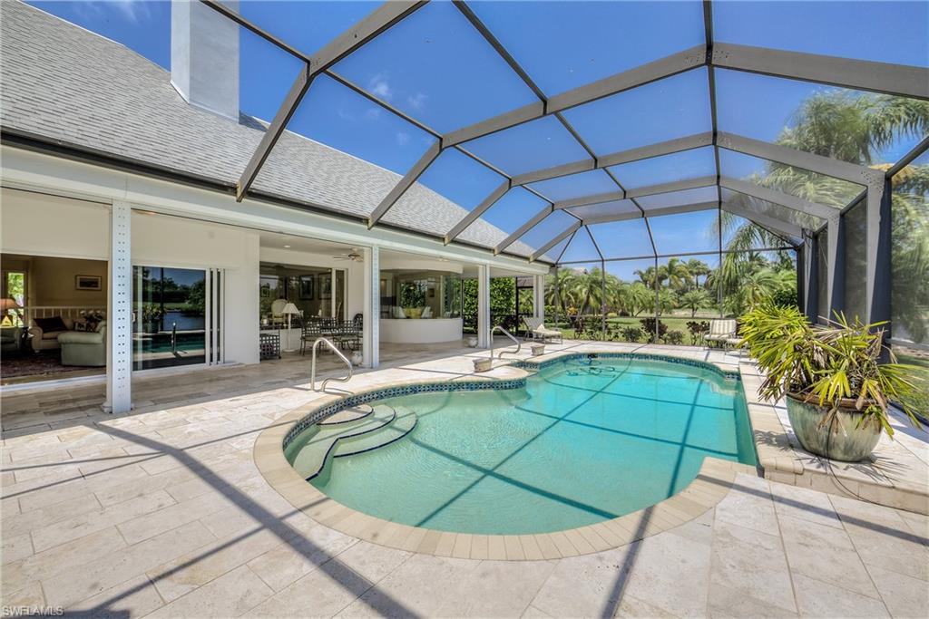 2260 Imperial Golf Course Boulevard Naples, FL 34110 - Photo 26 of 29 a view of a swimming pool with a patio