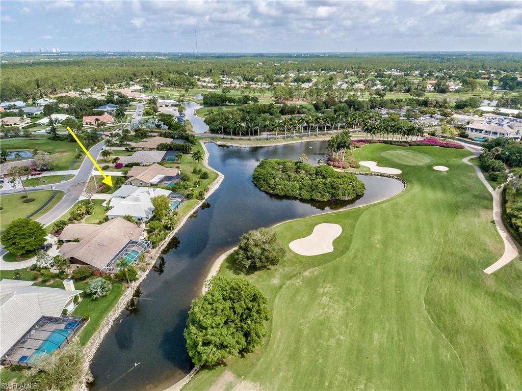 2260 Imperial Golf Course Boulevard Naples, FL 34110 - Photo 4 of 29 an aerial view of residential houses with outdoor space