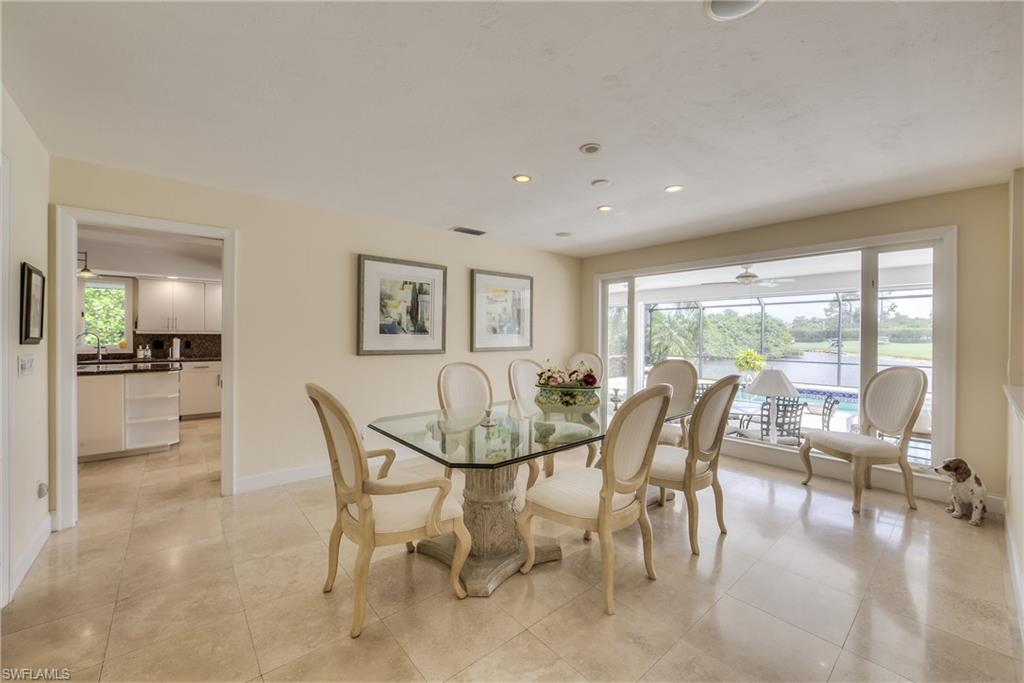 2260 Imperial Golf Course Boulevard Naples, FL 34110 - Photo 8 of 29 a view of a dining room with furniture window and outside view