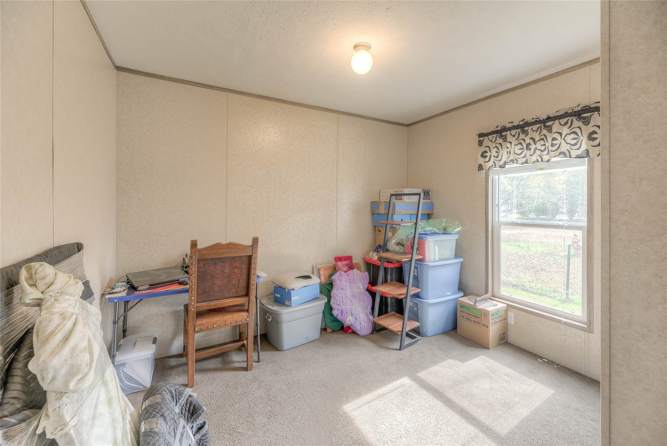138 Pecan Onalaska, TX 77360 - Photo 12 of 33 a view of a room with lounge chair and a window