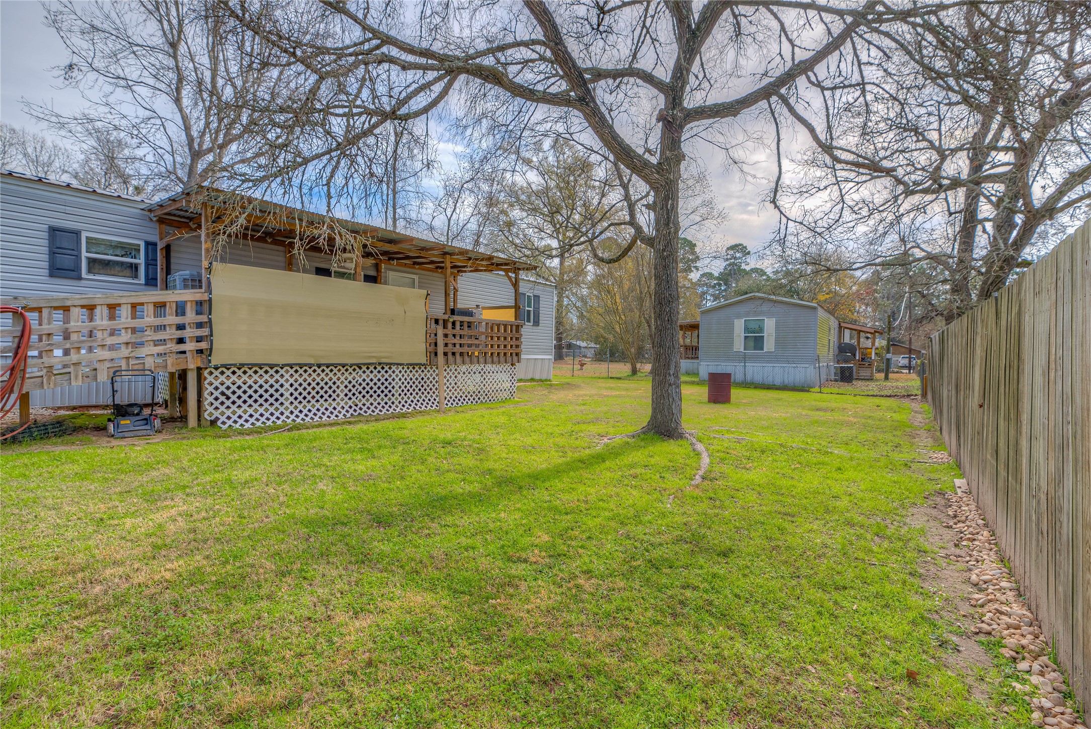 138 Pecan Onalaska, TX 77360 - Photo 20 of 33 a house view with a garden