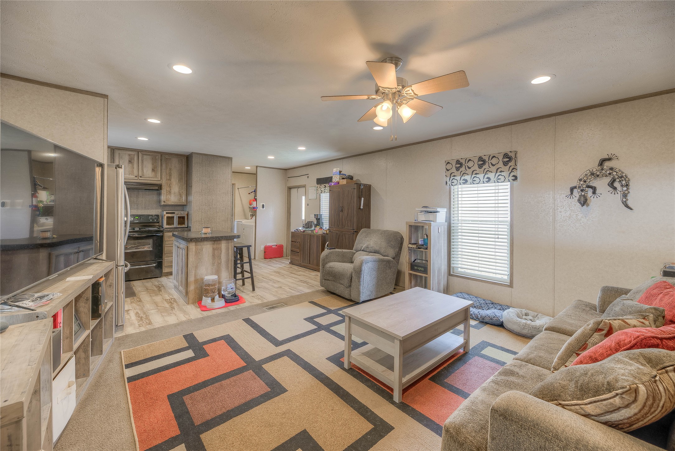 138 Pecan Onalaska, TX 77360 - Photo 2 of 33 a living room with furniture and kitchen view