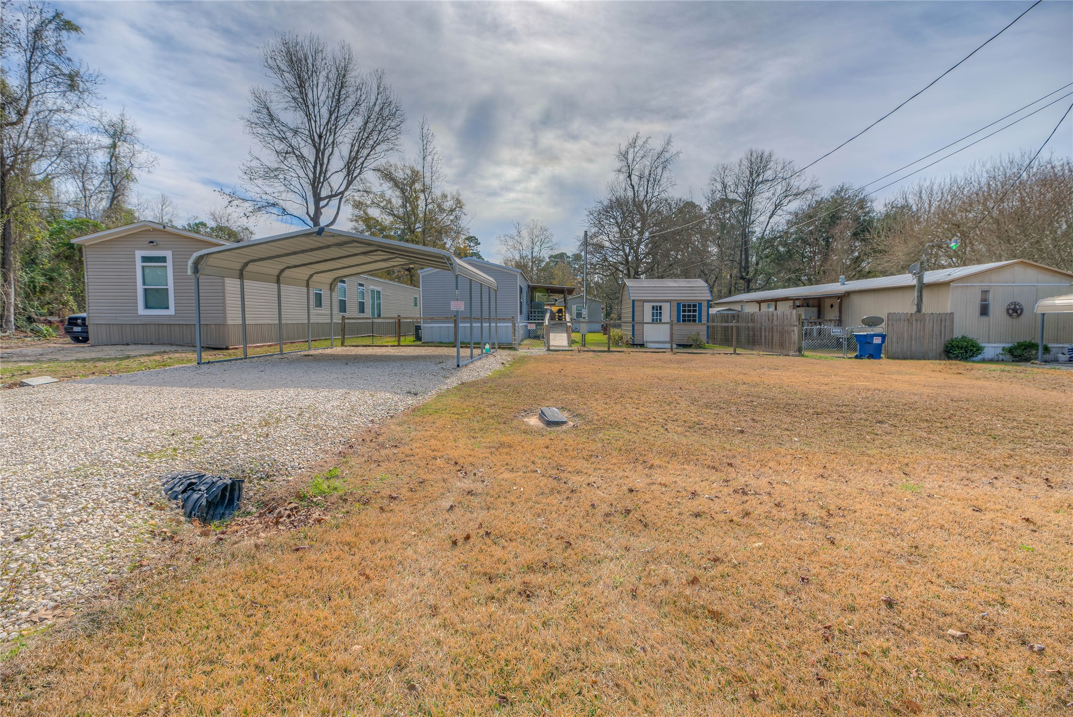 138 Pecan Onalaska, TX 77360 - Photo 23 of 33 a front view of a house with a yard and garage