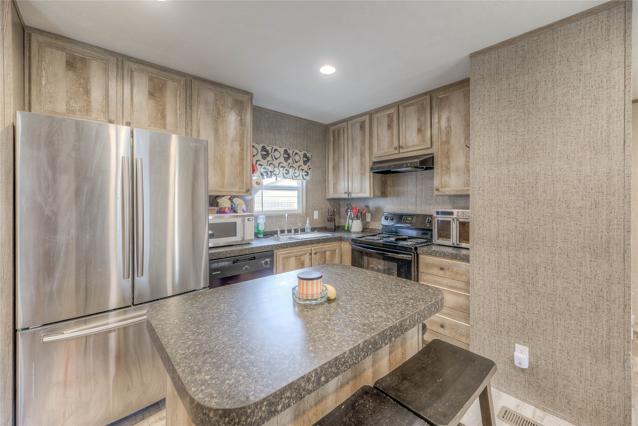 138 Pecan Onalaska, TX 77360 - Photo 4 of 33 a kitchen with granite countertop a refrigerator stove top oven and sink