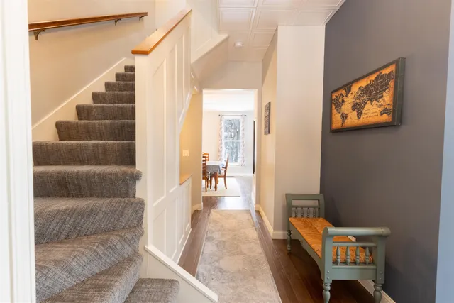 a view of an entryway with wooden floor