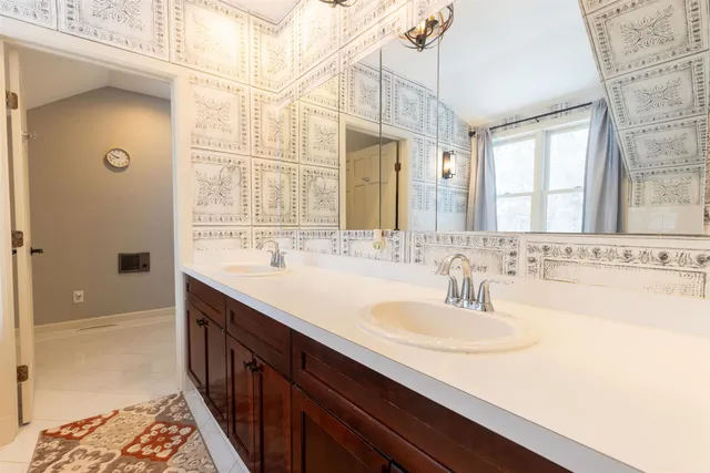 a bathroom with a sink and a mirror