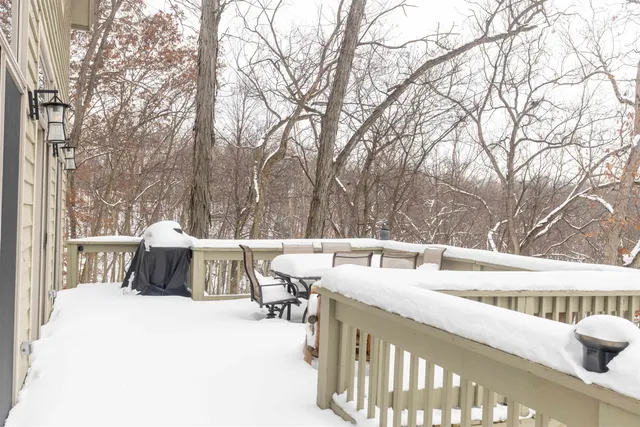 a view of a patio with a bed and couches