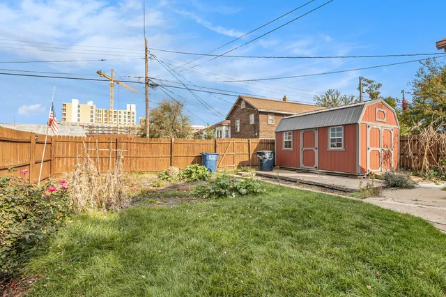 a view of a house with a backyard