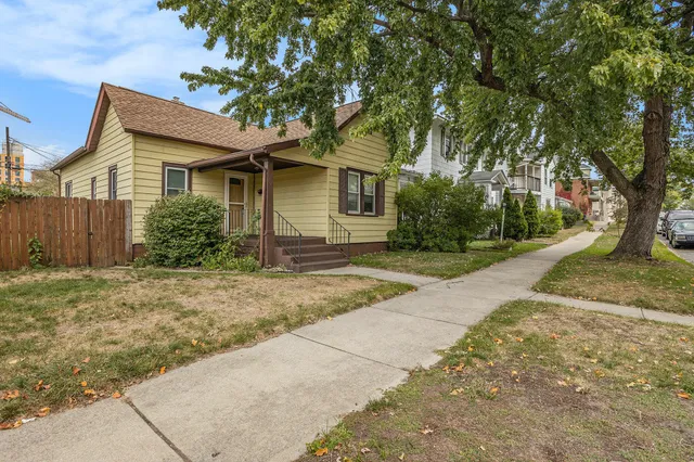 front view of a house with a yard