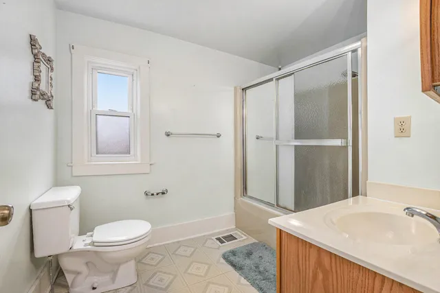 a bathroom with a sink toilet and vanity