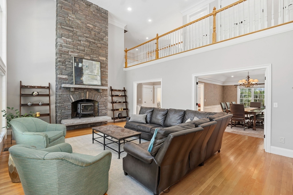 220 Newtown Road Acton, MA 01720 - Photo 7 of 39 a living room with furniture and a fireplace