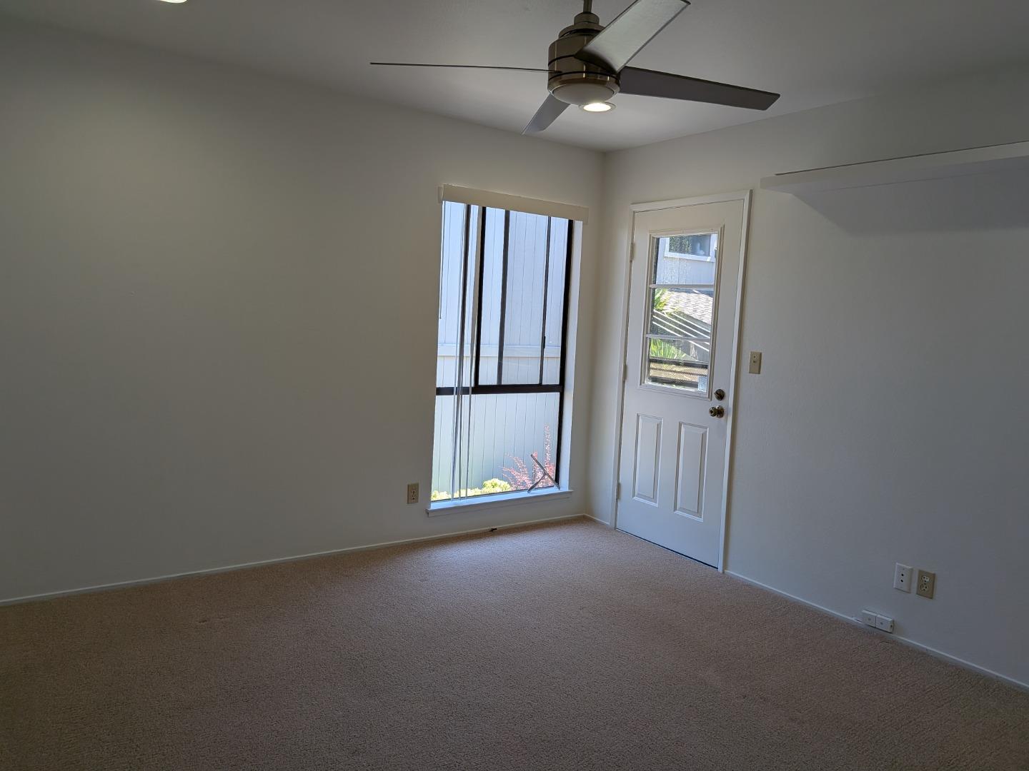 217 Ada Avenue, Unit 45 Mountain View, CA 94043 - Photo 24 of 43 an empty room with windows and cabinet