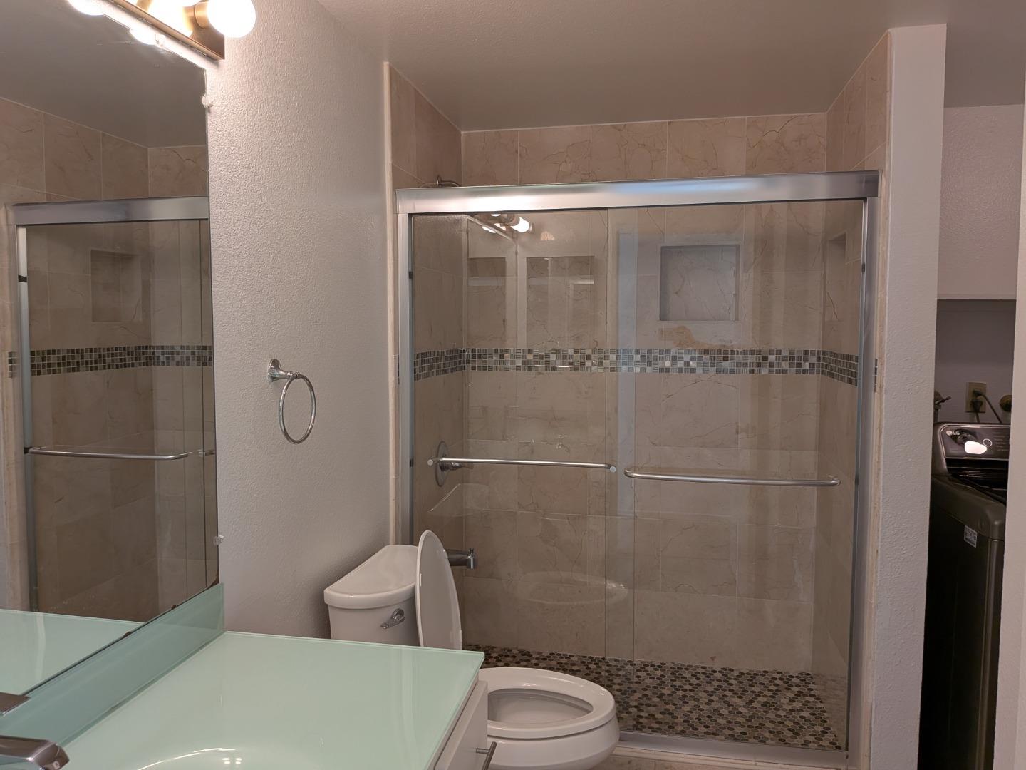 217 Ada Avenue, Unit 45 Mountain View, CA 94043 - Photo 32 of 43 a bathroom with a toilet and a shower