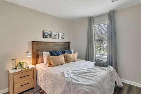 a bedroom with a bed and window