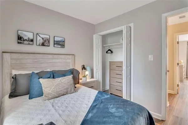 a bedroom with a bed and a couch