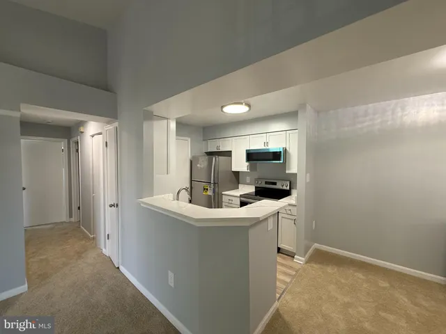 a room with a sink a washer and dryer