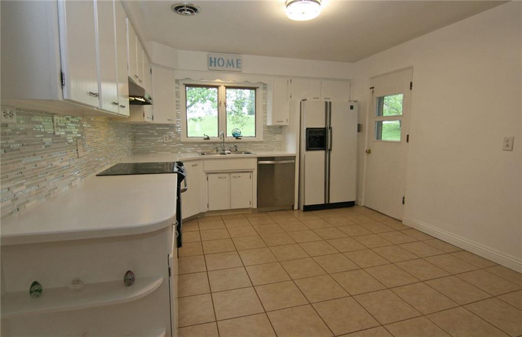 105 Center Church Road Canonsburg, PA 15317 - Photo 11 of 25 Fully equipped with appliances, double window over the sink, plus an exterior door that opens to the large partially covered patio and rear property....