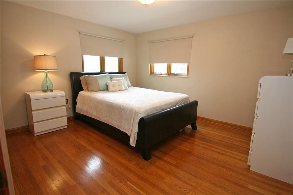 105 Center Church Road Canonsburg, PA 15317 - Photo 14 of 25 Master bedroom with gleaming hardwood floor and ceiling light fixture...