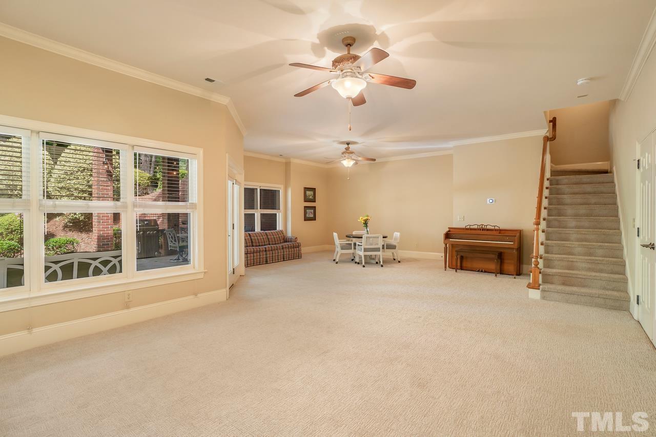 248 Waterville Street Raleigh, NC 27603 - Photo 19 of 30 an empty room with windows and ceiling fan