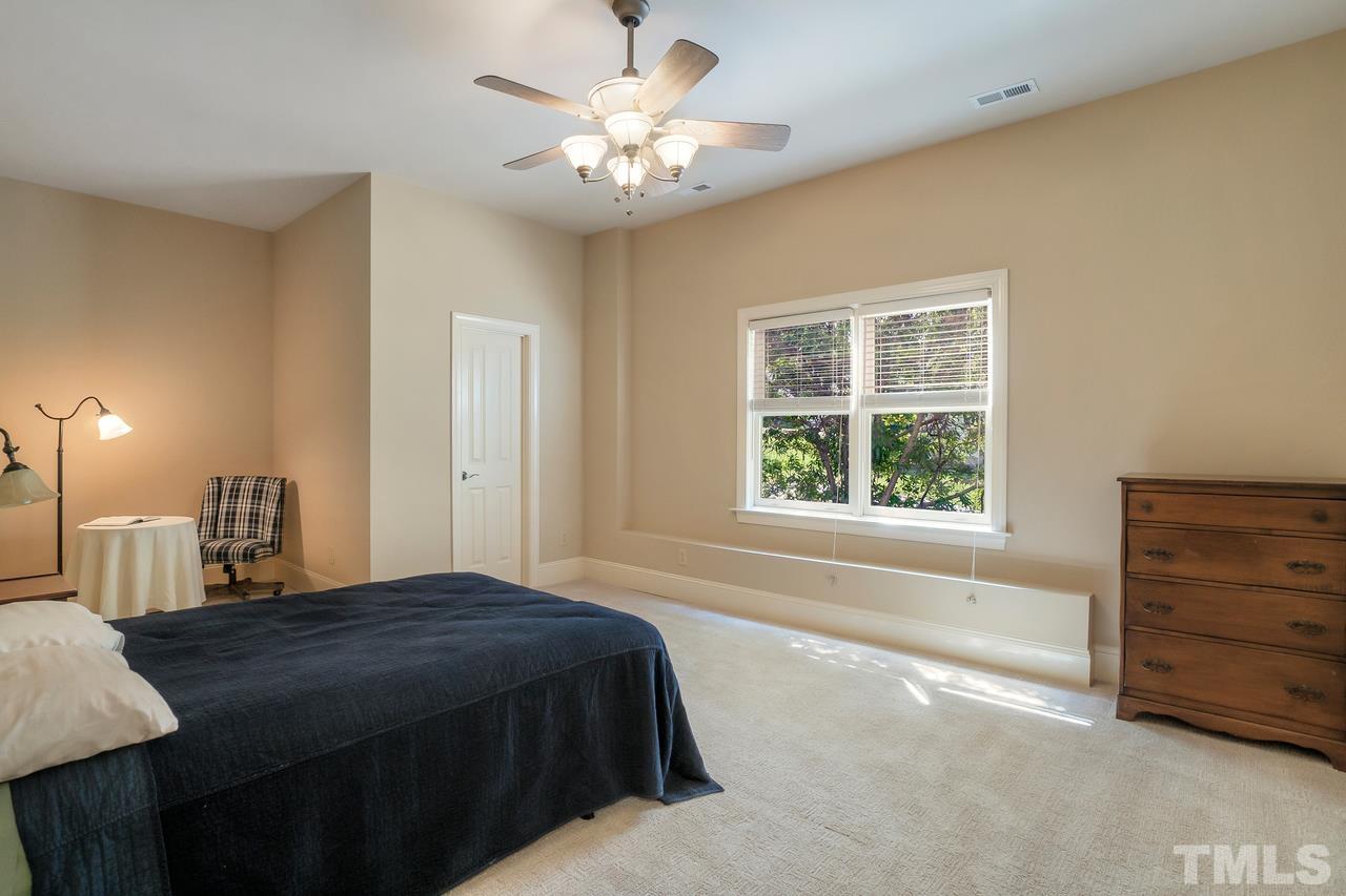 248 Waterville Street Raleigh, NC 27603 - Photo 23 of 30 a spacious bedroom with a bed and a window