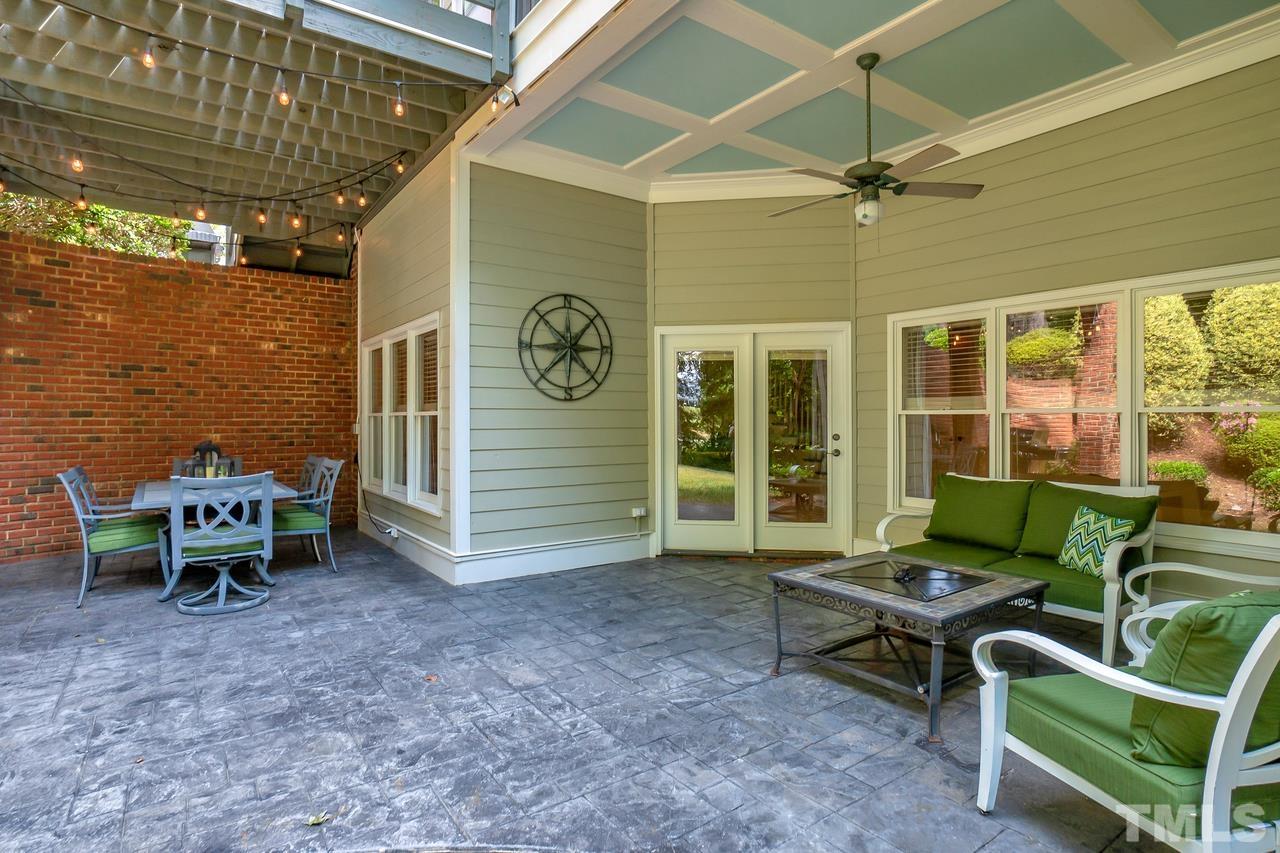 248 Waterville Street Raleigh, NC 27603 - Photo 25 of 30 a backyard of a house with yard and outdoor seating
