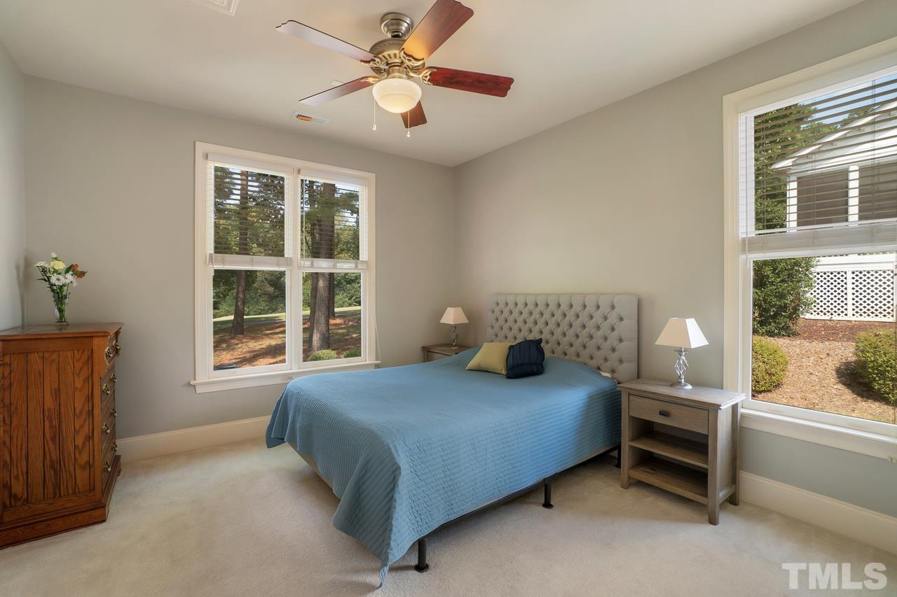 248 Waterville Street Raleigh, NC 27603 - Photo 27 of 30 a bedroom with a bed and a large window