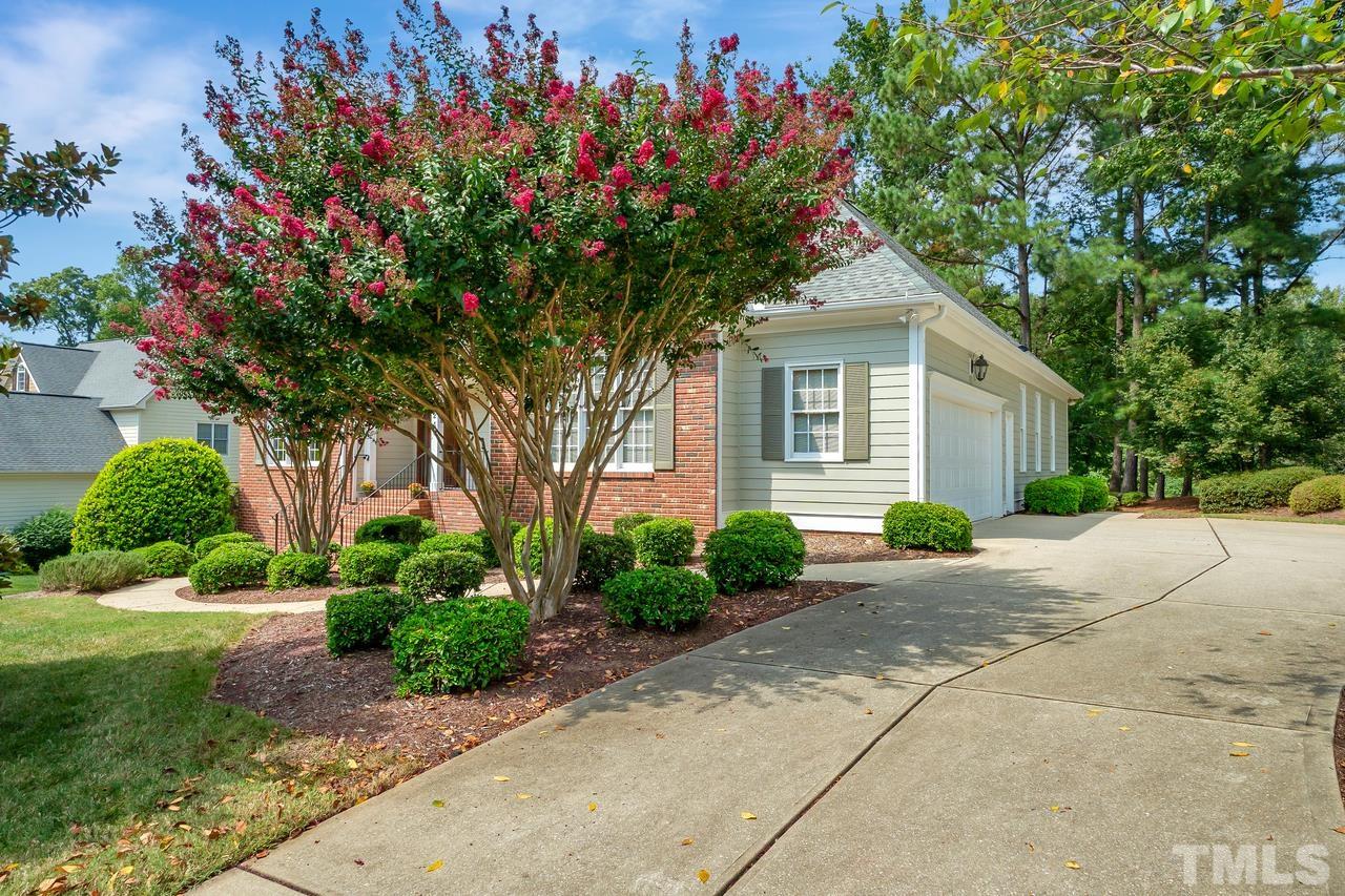 248 Waterville Street Raleigh, NC 27603 - Photo 30 of 30 a house with a yard and a large tree