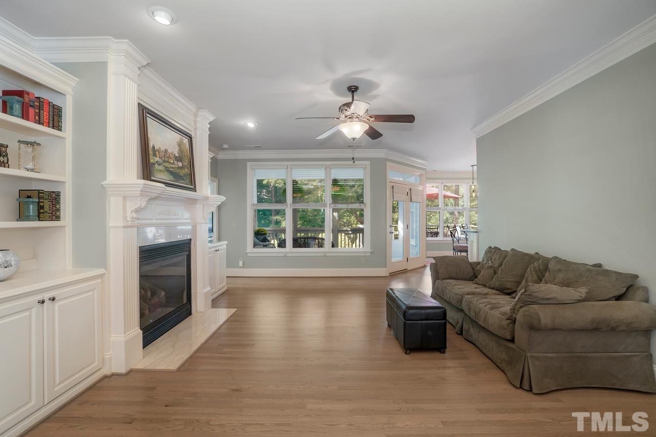 248 Waterville Street Raleigh, NC 27603 - Photo 7 of 30 a living room with furniture large window and fireplace