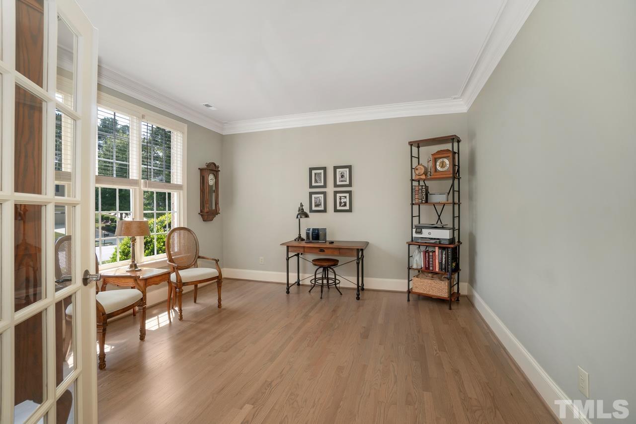 248 Waterville Street Raleigh, NC 27603 - Photo 8 of 30 a living room with furniture and a wooden floor