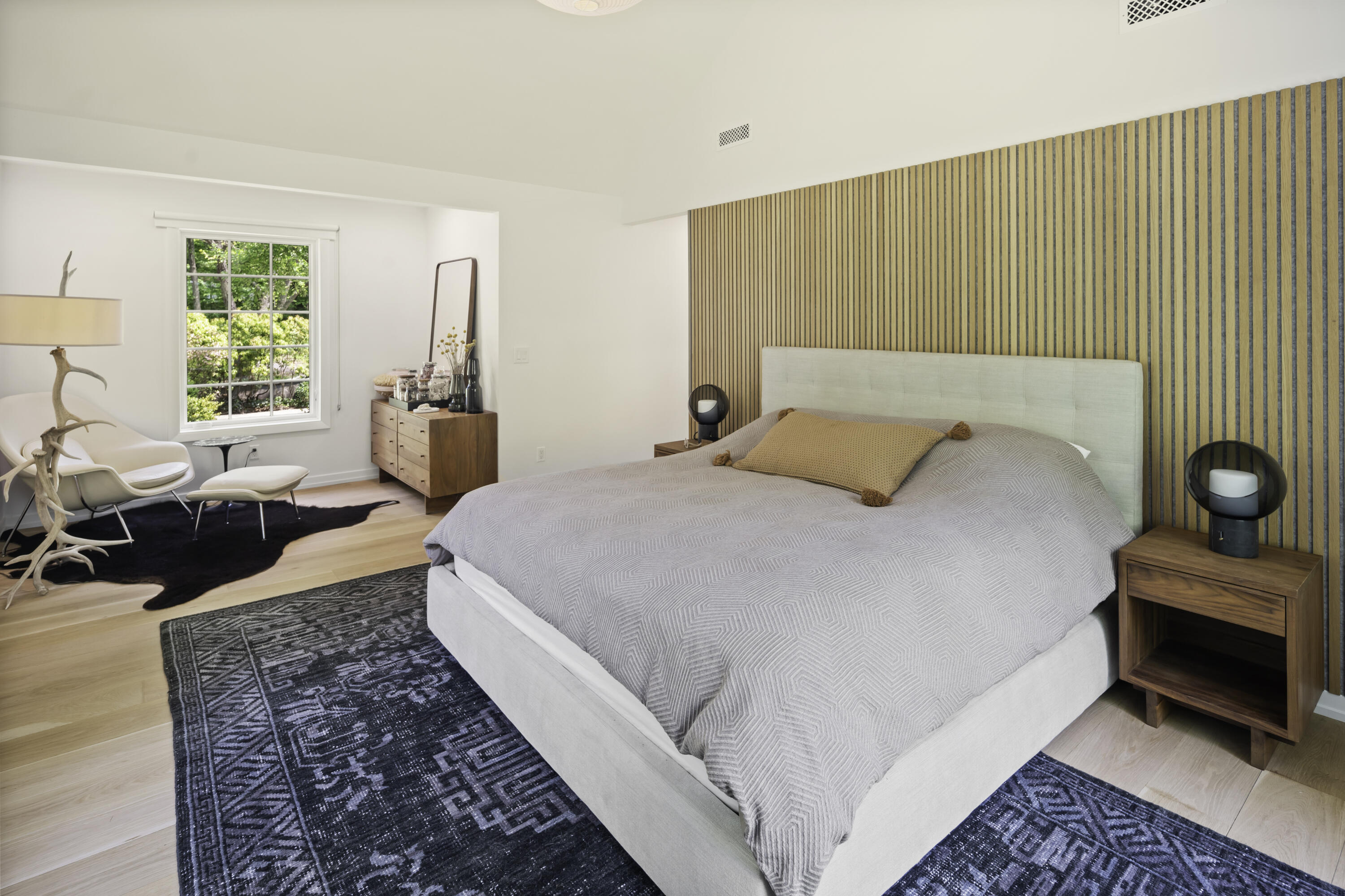 86 Logan Road New Canaan, CT 06840 - Photo 17 of 38 a bedroom with a bed and large windows