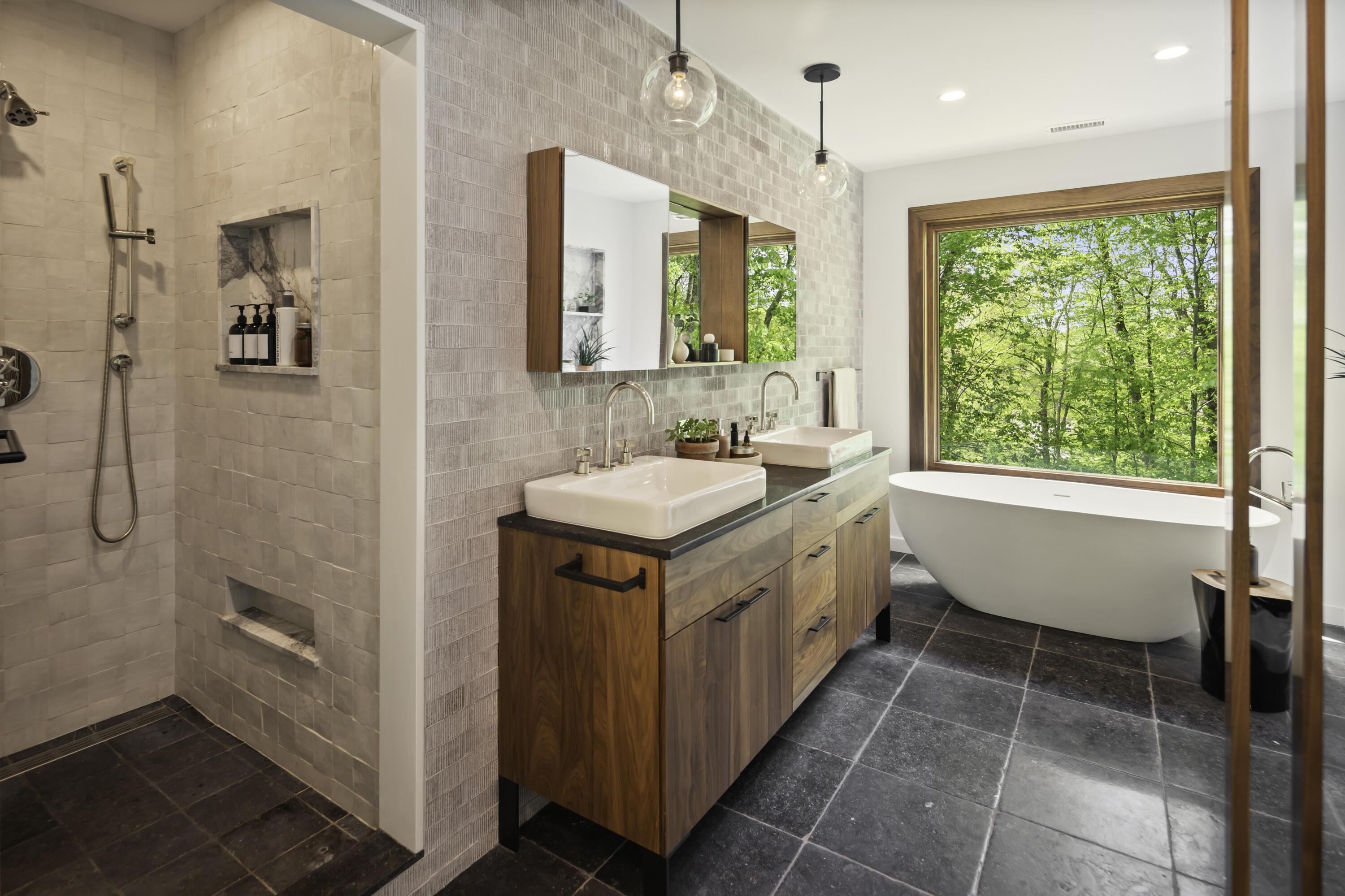 86 Logan Road New Canaan, CT 06840 - Photo 20 of 38 a bathroom with a double vanity sink a mirror and a bathtub