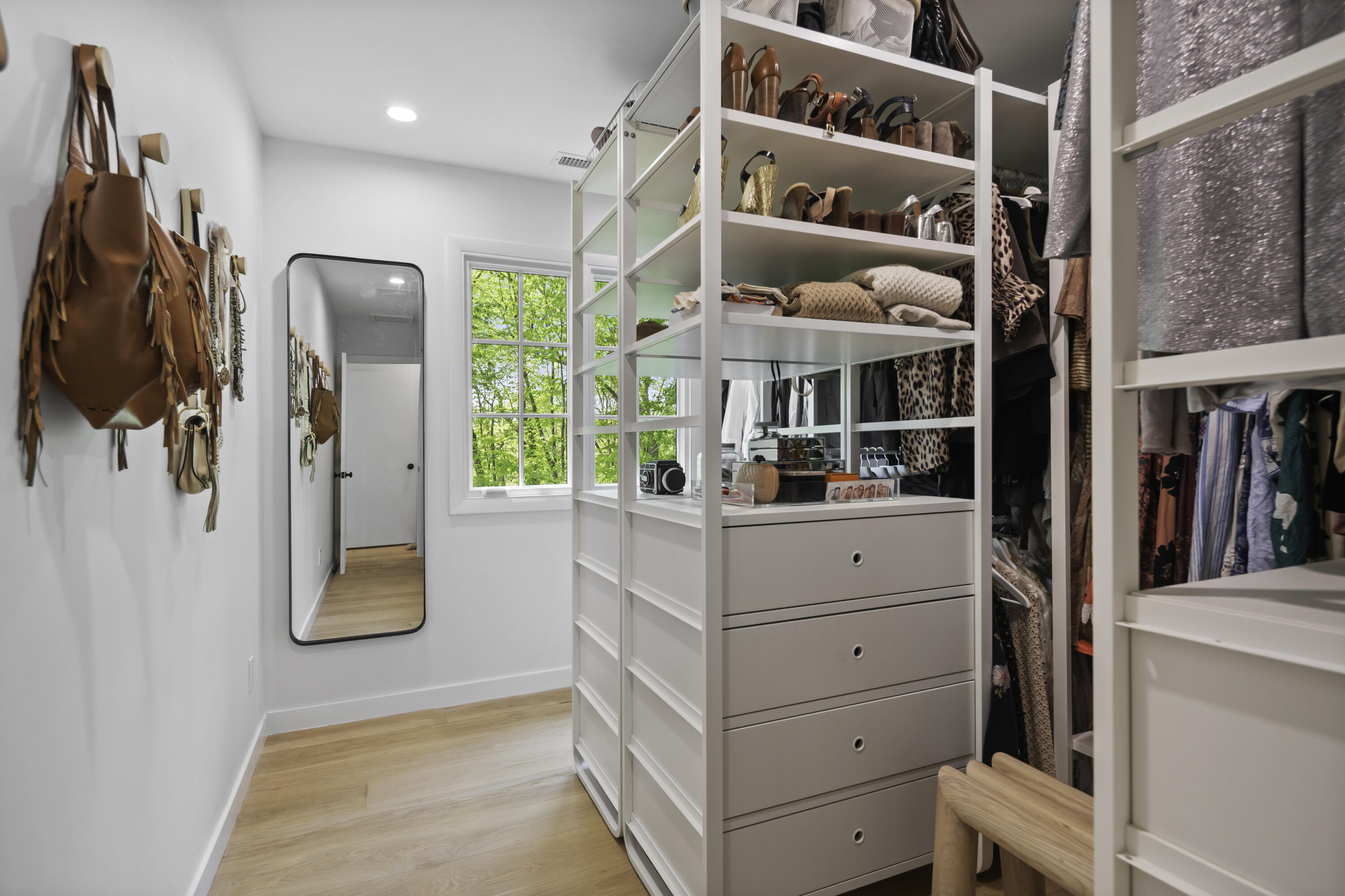 86 Logan Road New Canaan, CT 06840 - Photo 21 of 38 a view of walk in closet with clothes and shoes