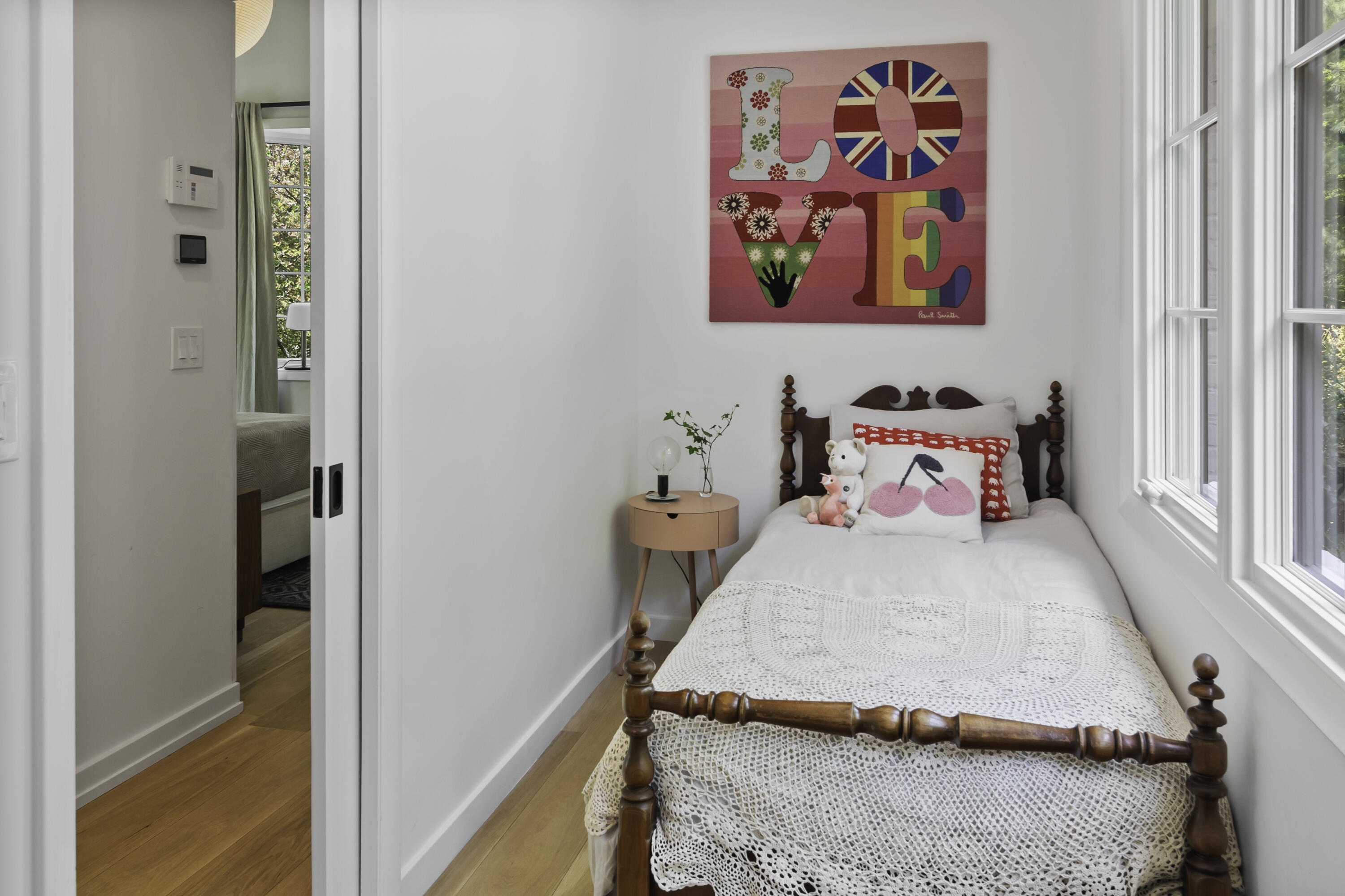 86 Logan Road New Canaan, CT 06840 - Photo 22 of 38 a bedroom with a bed and painting on the wall