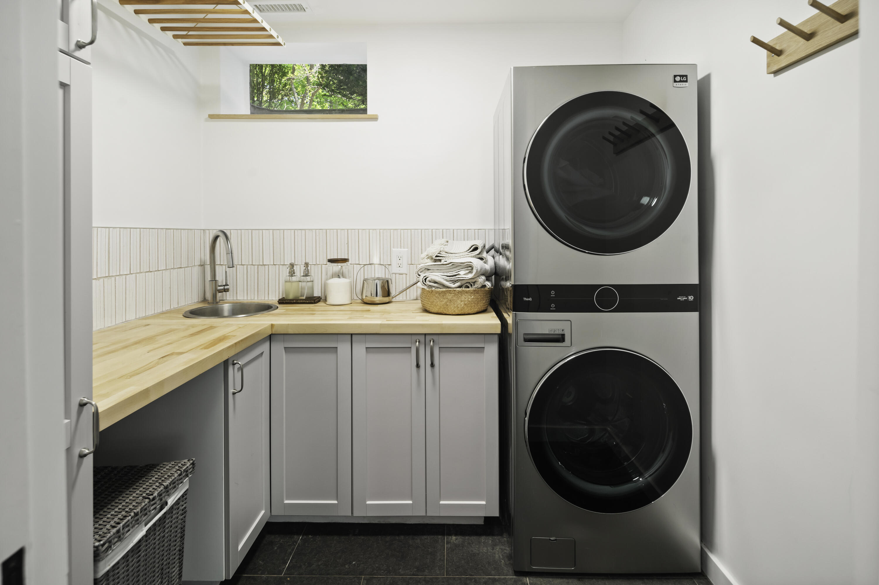 86 Logan Road New Canaan, CT 06840 - Photo 31 of 38 a utility room with sink dryer and washer