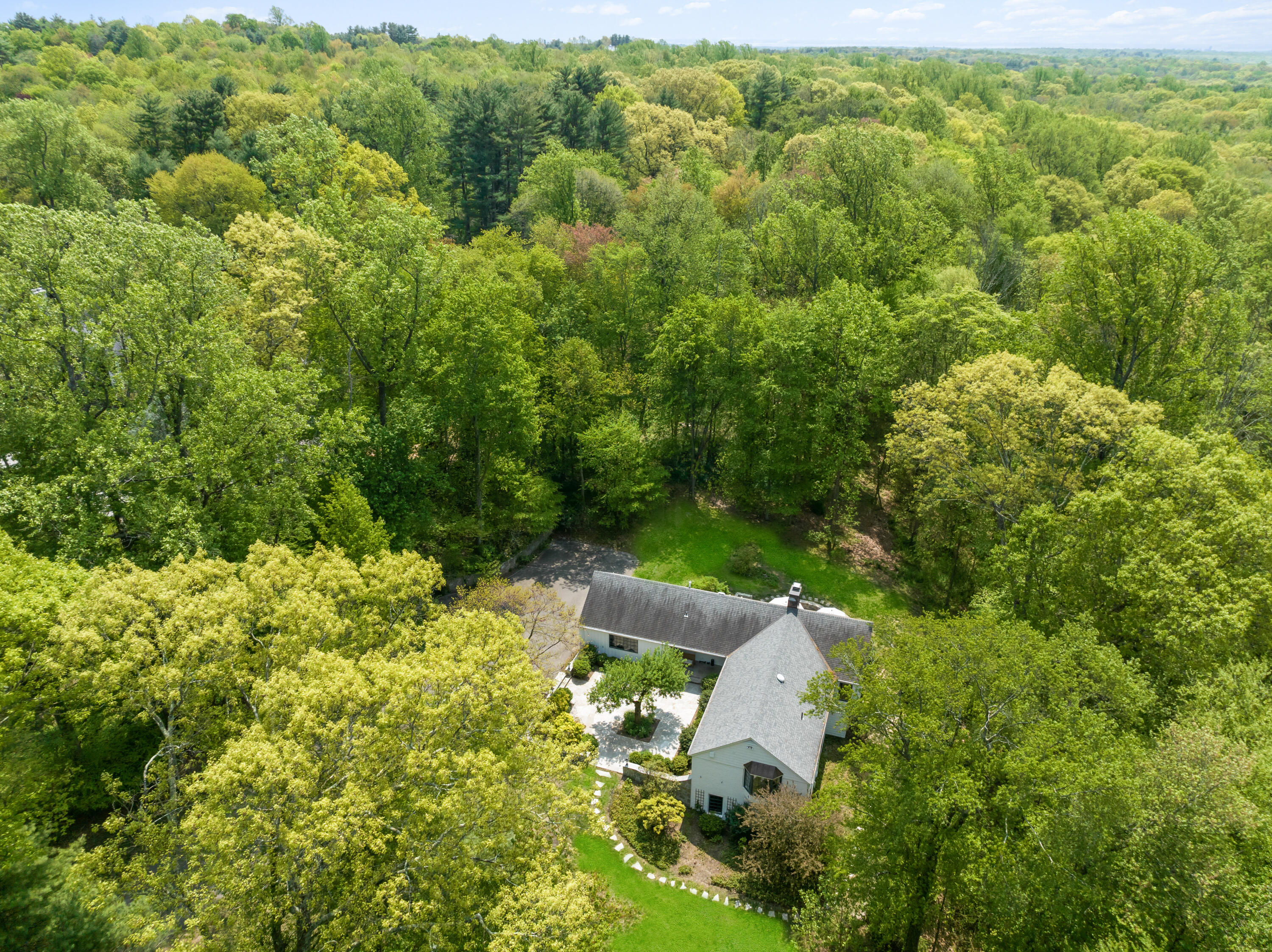 86 Logan Road New Canaan, CT 06840 - Photo 36 of 38 an aerial view of a house with a yard
