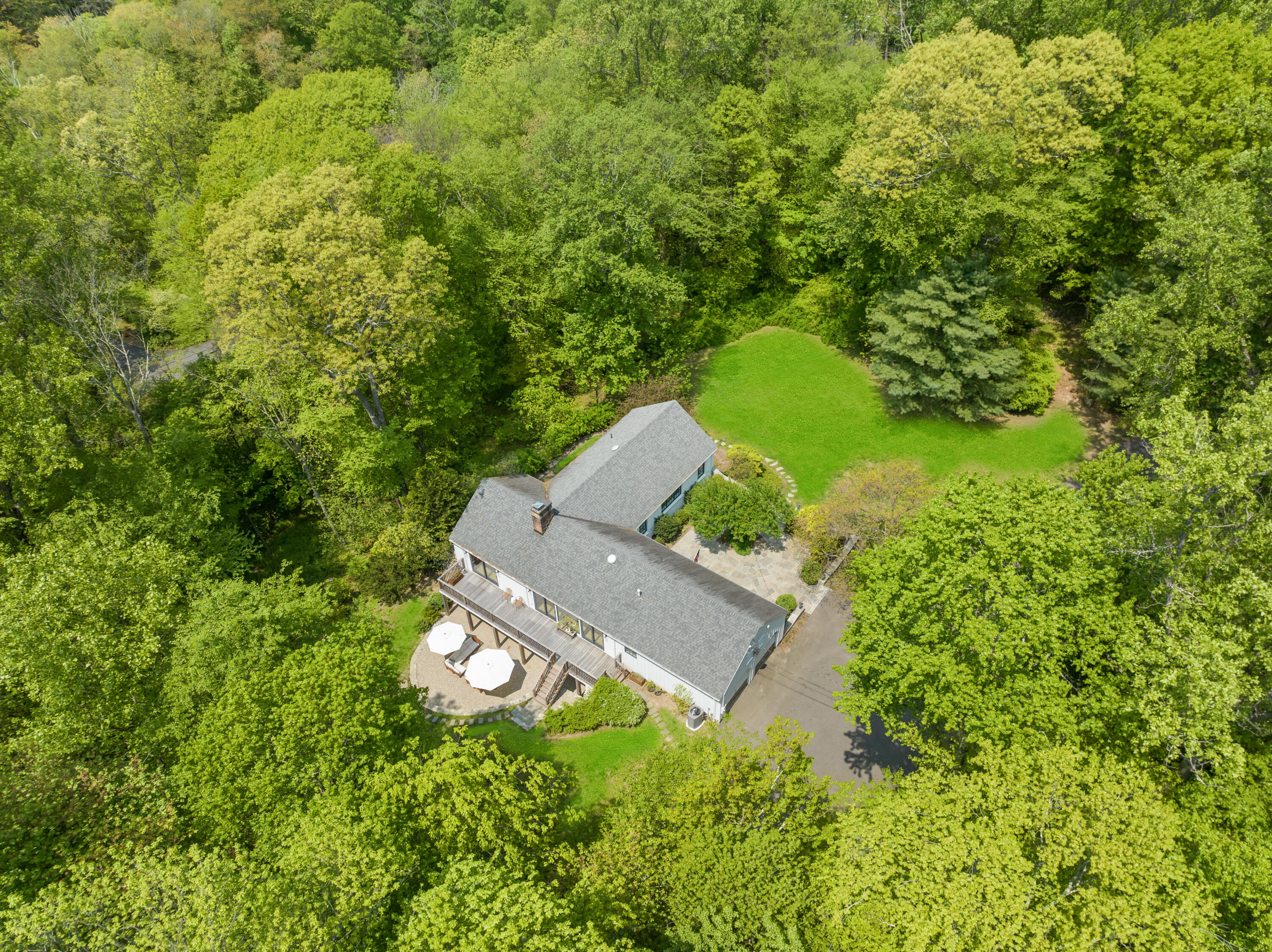 86 Logan Road New Canaan, CT 06840 - Photo 37 of 38 an aerial view of a house with a yard