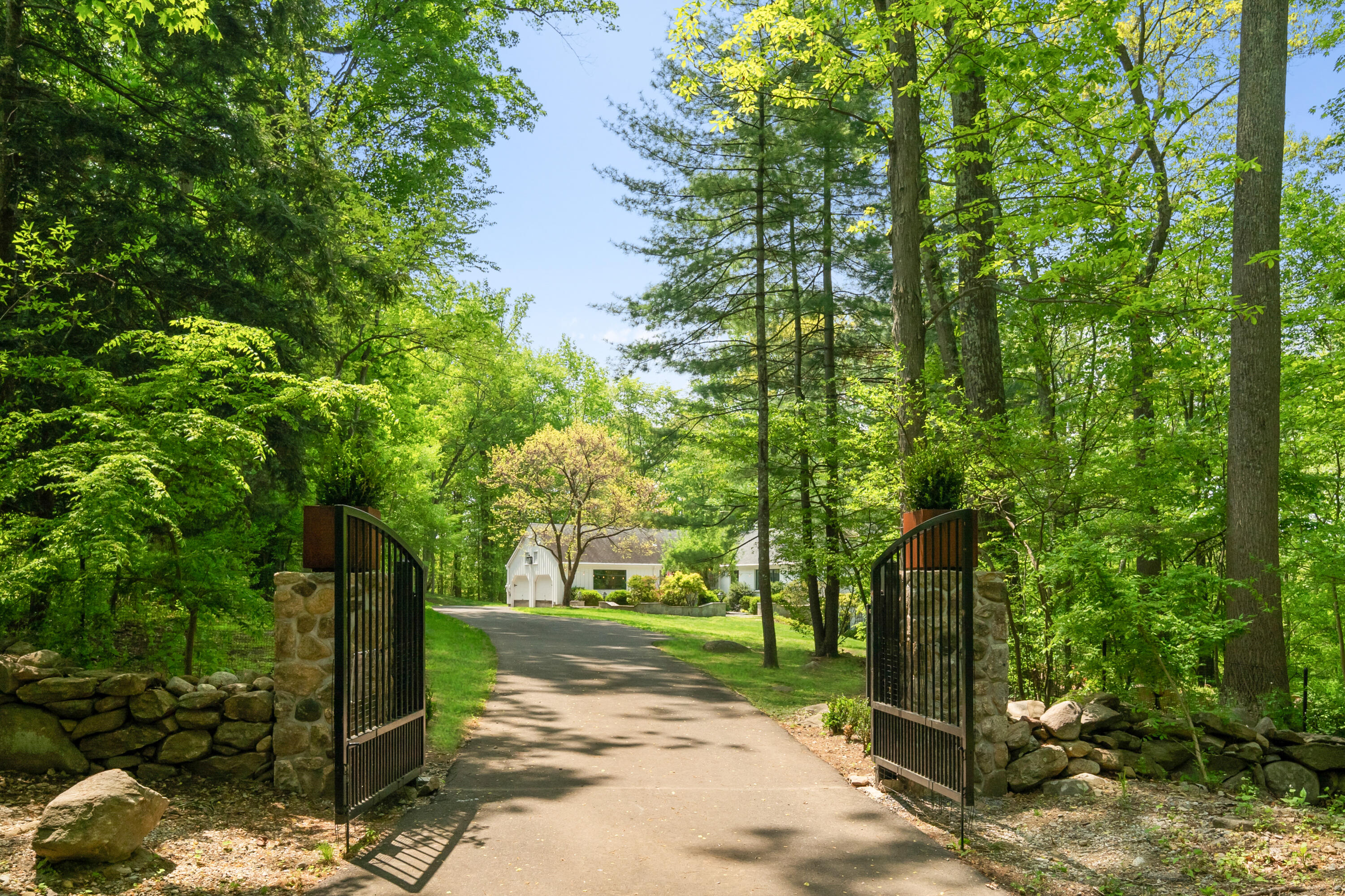 86 Logan Road New Canaan, CT 06840 - Photo 38 of 38 a view of a street with a tree