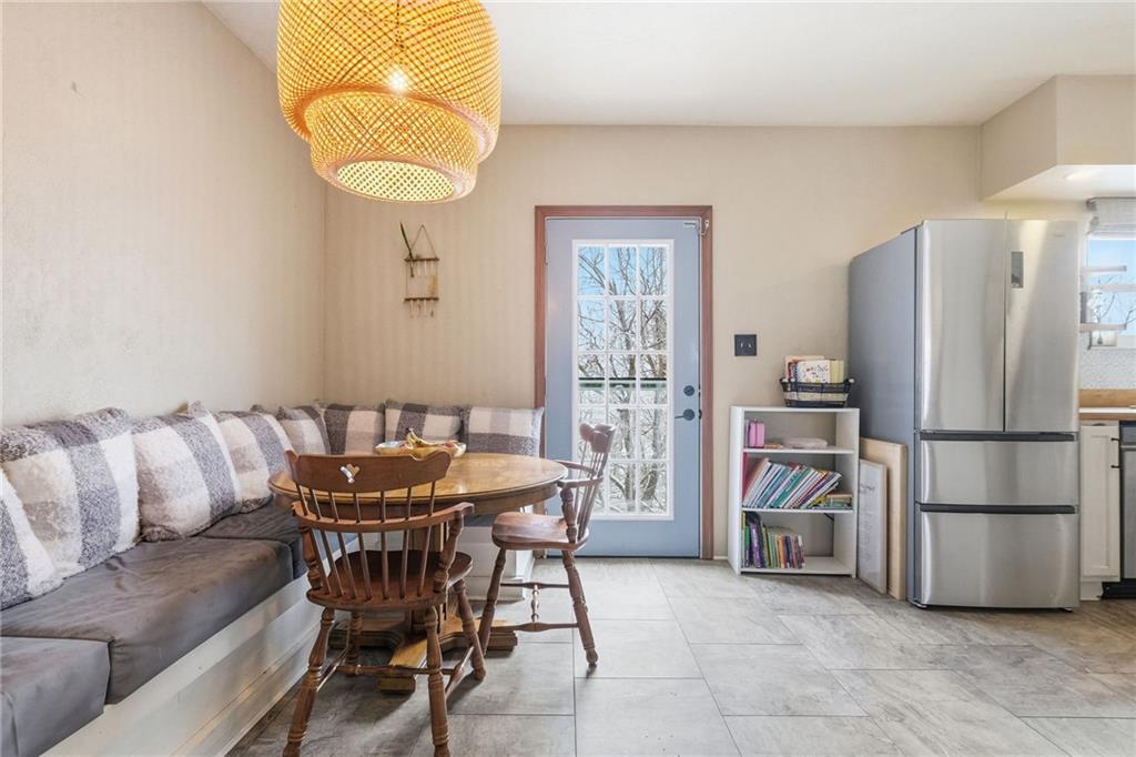 106 Logan Street Pittsburgh, PA 15209 - Photo 16 of 40 a dining room with furniture and a window