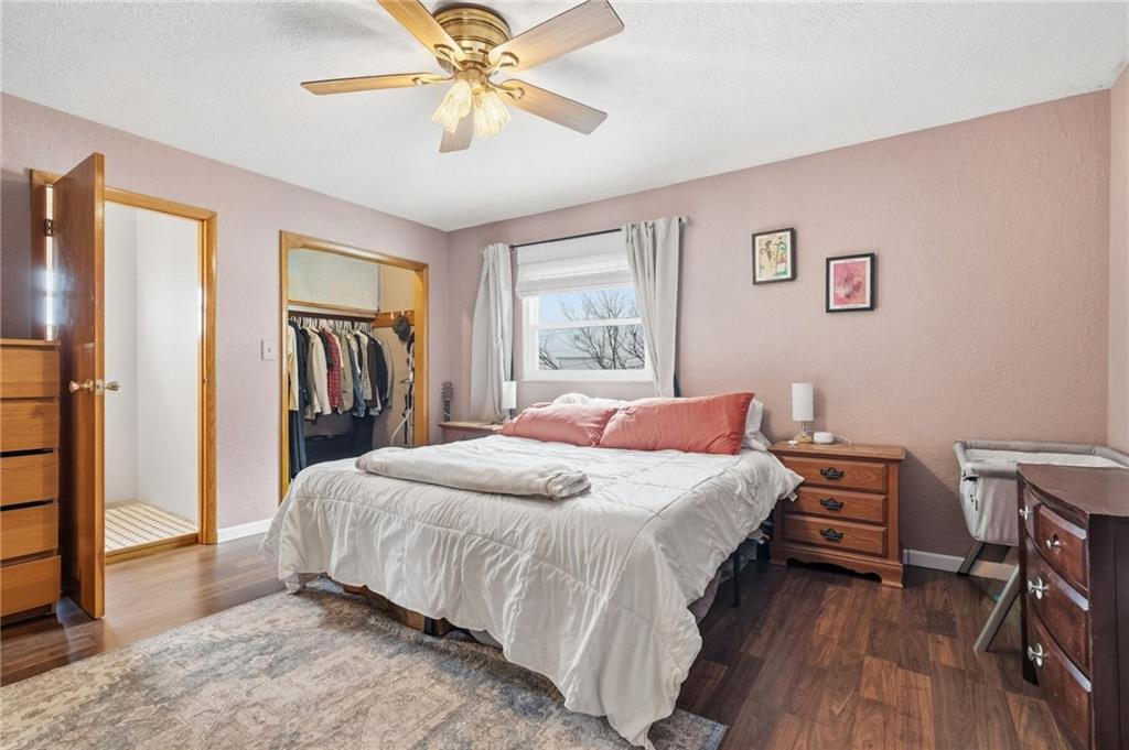 106 Logan Street Pittsburgh, PA 15209 - Photo 21 of 40 a bedroom with a bed and a chandelier