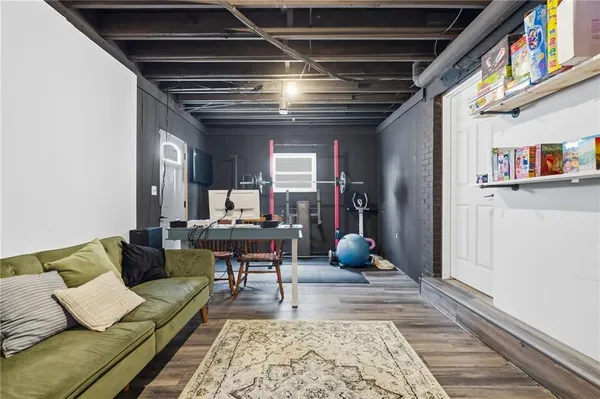 a living room with furniture and a rug