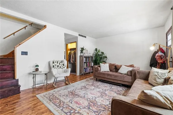 a living room with furniture and a rug