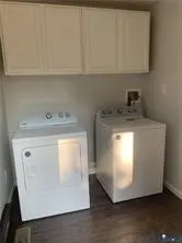 a utility room with washer and dryer