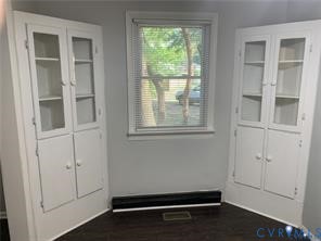 3324 Meadowbridge Road Richmond, VA 23222 - Photo 9 of 38 an empty room with wooden floor and windows
