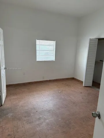 a kitchen with stainless steel appliances granite countertop a sink and a stove