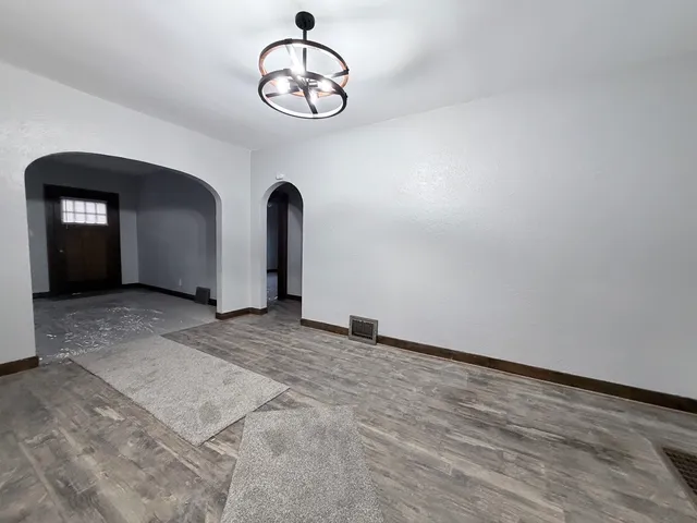 a view of an empty room with a window