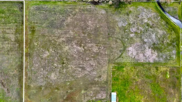 a view of a lake with houses in the back