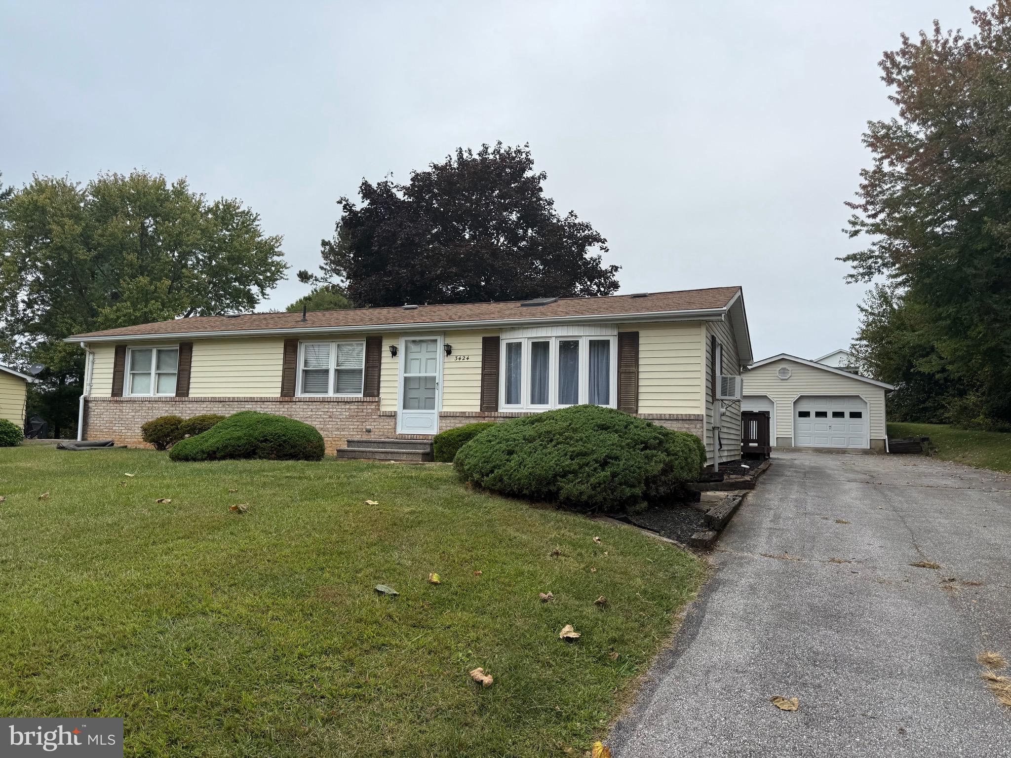 3424 Hampstead Mexico Road Hampstead, MD 21074 - Photo 2 of 26 a view of a house with a yard and potted plants