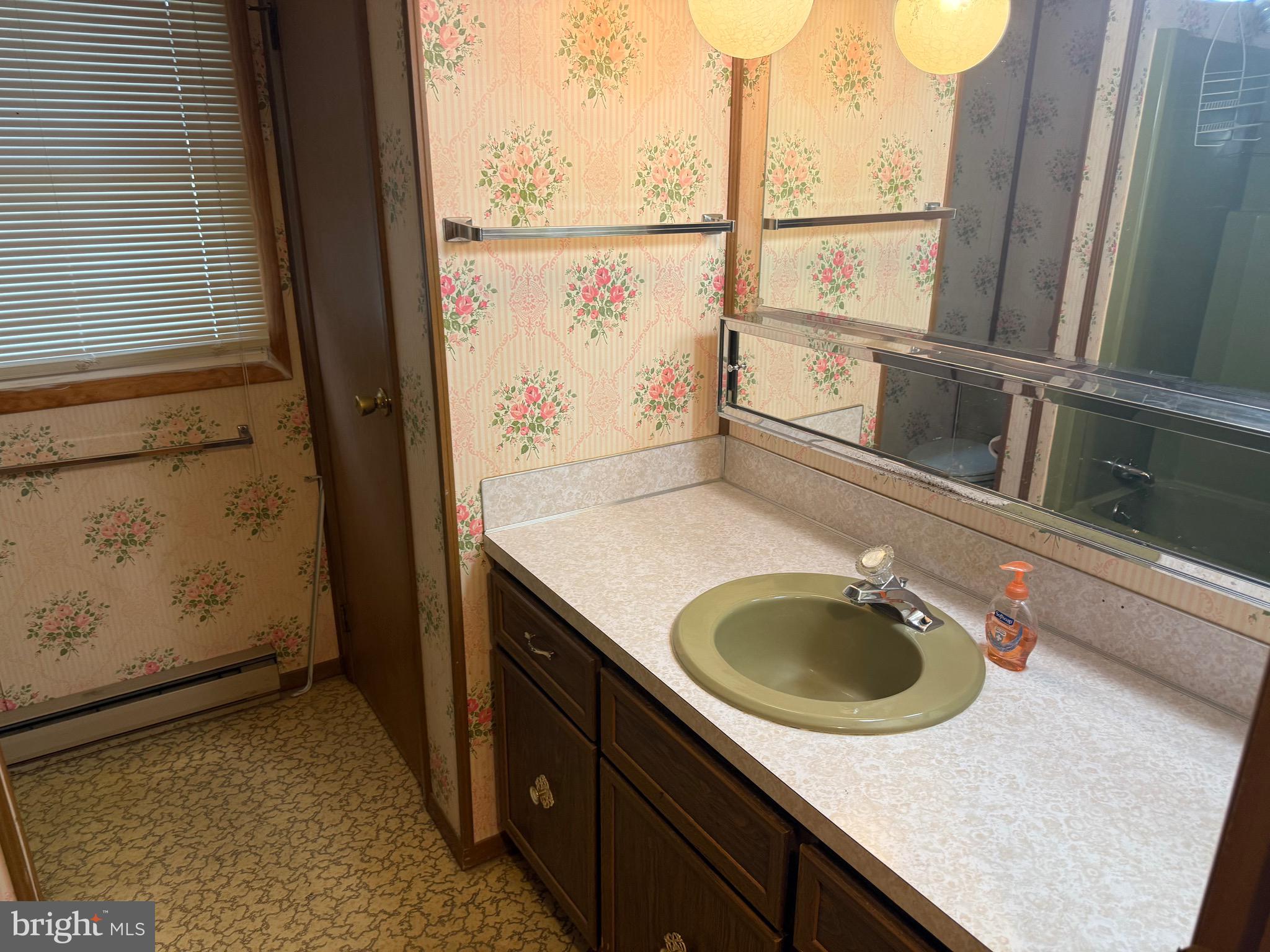 3424 Hampstead Mexico Road Hampstead, MD 21074 - Photo 22 of 26 a bathroom with a sink a washer and dryer