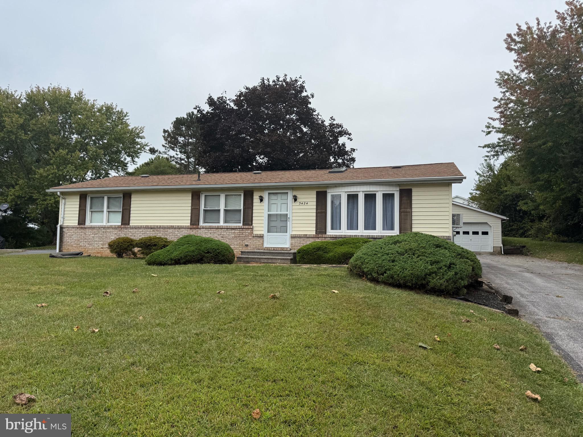 3424 Hampstead Mexico Road Hampstead, MD 21074 - Photo 3 of 26 a view of a house next to a big yard and large trees