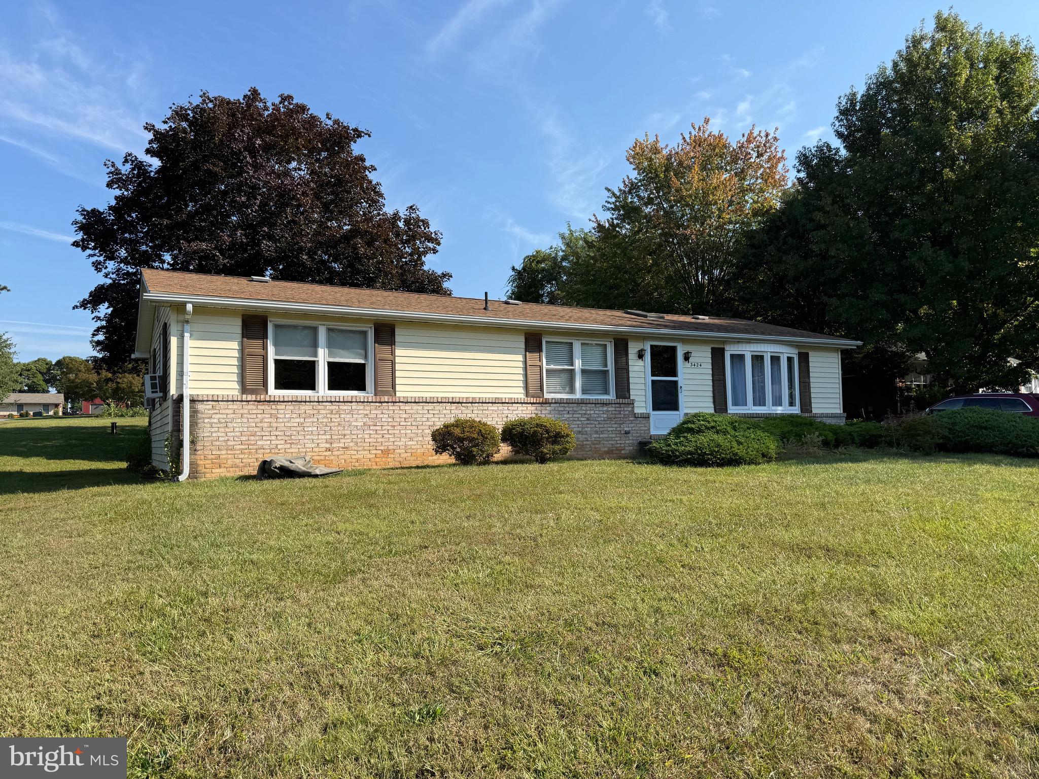 3424 Hampstead Mexico Road Hampstead, MD 21074 - Photo 5 of 26 a front view of a house with a yard